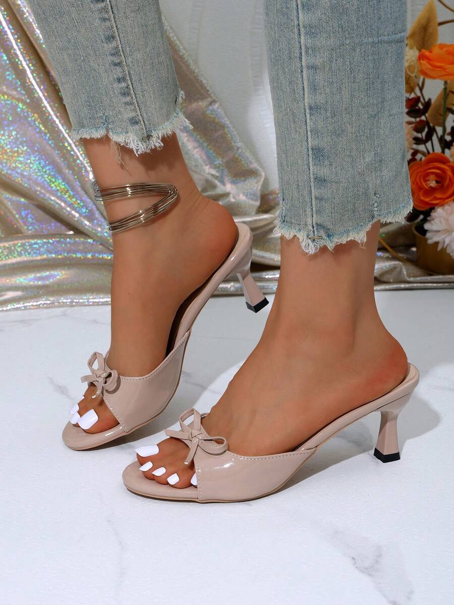 Women's open toe stiletto sandals in PU leather featuring slip-on slingback straps and bow accents for summer parties