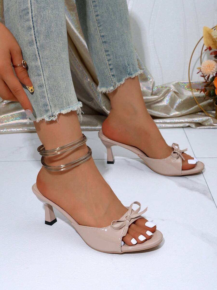 Women's open toe stiletto sandals in PU leather featuring slip-on slingback straps and bow accents for summer parties
