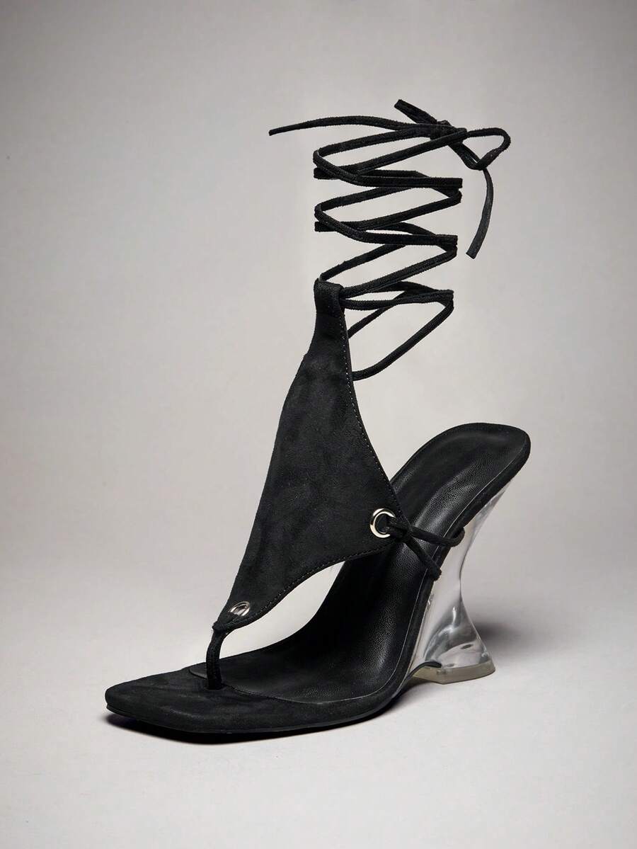 Women's slip-on thong strap wedge sandals featuring a high wedge heel and smooth PU leather upper.