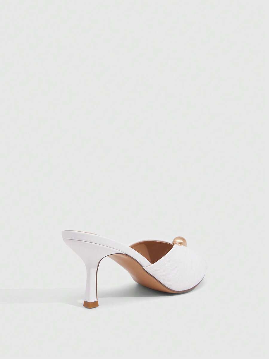 Pair of women's open toe kitten heel sandals and mules in sleek PU leather with rubber soles.