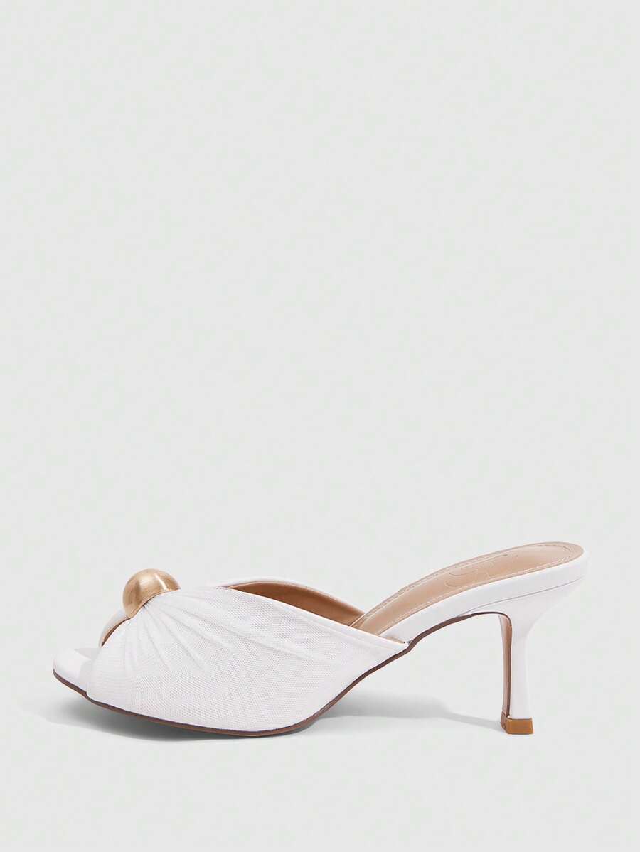 Pair of women's open toe kitten heel sandals and mules in sleek PU leather with rubber soles.