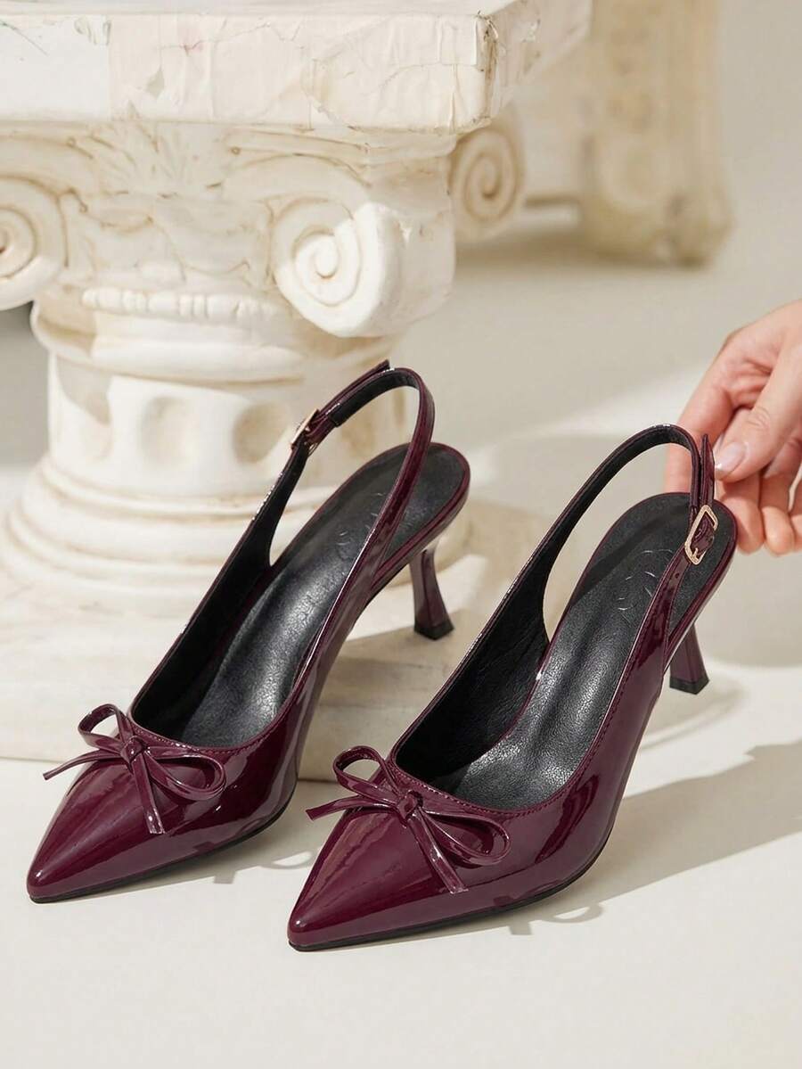 Beige pointed toe high heel pumps featuring a sleek stiletto heel and slingback strap for women.