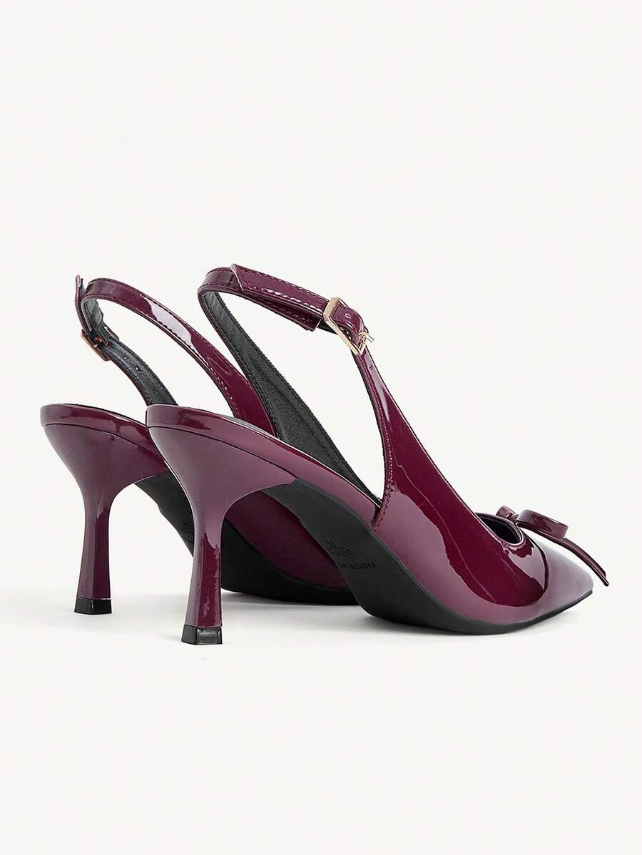 Beige pointed toe high heel pumps featuring a sleek stiletto heel and slingback strap for women.