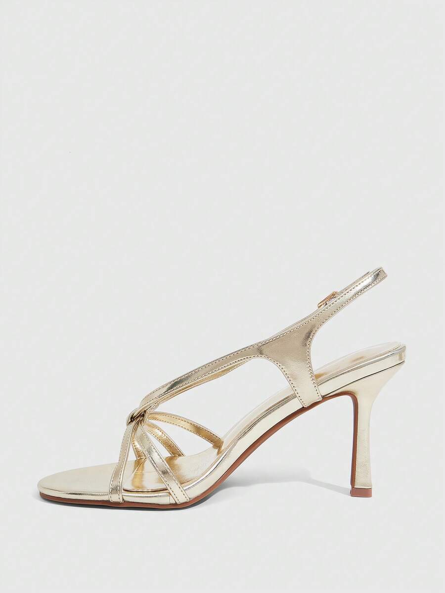 Women's high heel sandals featuring pleated strap detailing, an adjustable ankle strap with buckle closure, round open toe, and slim stiletto heel.