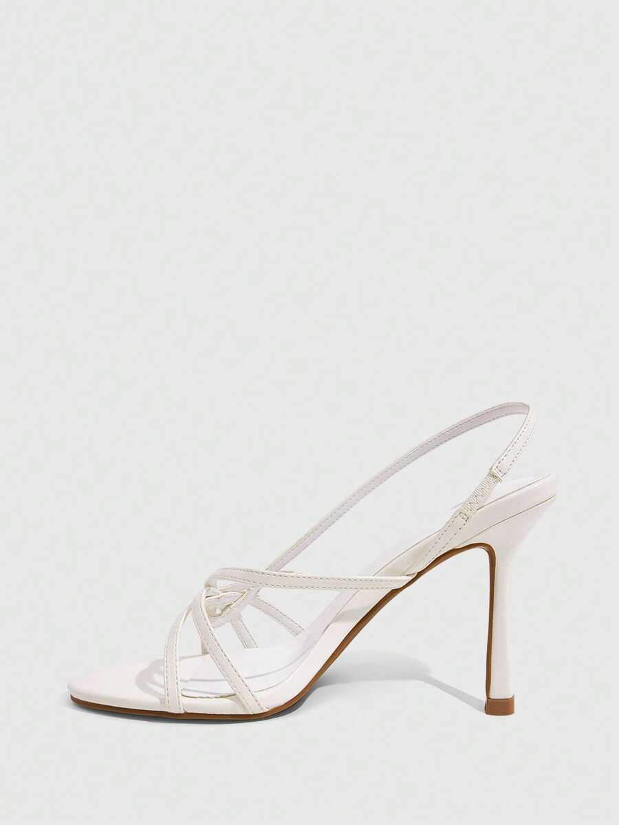 Women's high heel sandals featuring pleated strap detailing, an adjustable ankle strap with buckle closure, round open toe, and slim stiletto heel.