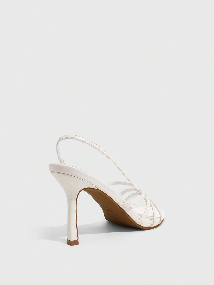 Women's high heel sandals featuring pleated strap detailing, an adjustable ankle strap with buckle closure, round open toe, and slim stiletto heel.