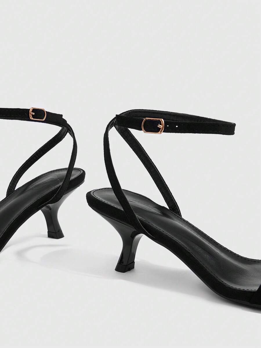 Women's open-toed high-heeled sandals featuring a 5.5cm kitten heel stiletto, sleek ankle strap with buckle closure, and smooth PU leather finish.