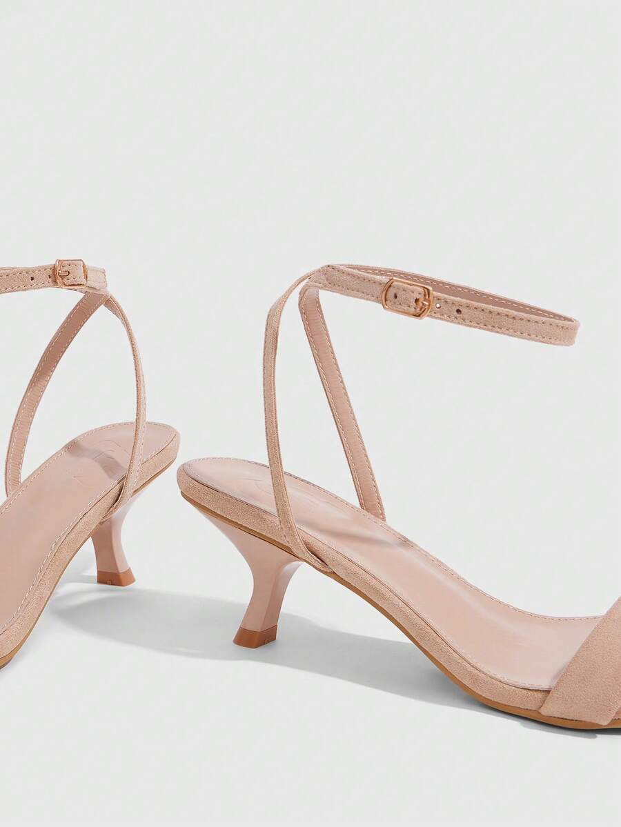Women's open-toed high-heeled sandals featuring a 5.5cm kitten heel stiletto, sleek ankle strap with buckle closure, and smooth PU leather finish.