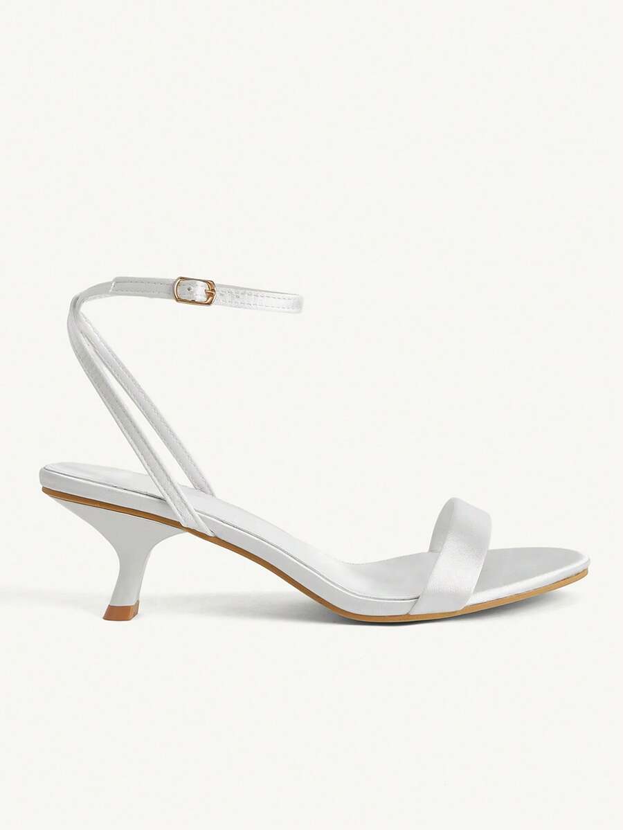 Women's open-toed high-heeled sandals featuring a 5.5cm kitten heel stiletto, sleek ankle strap with buckle closure, and smooth PU leather finish.