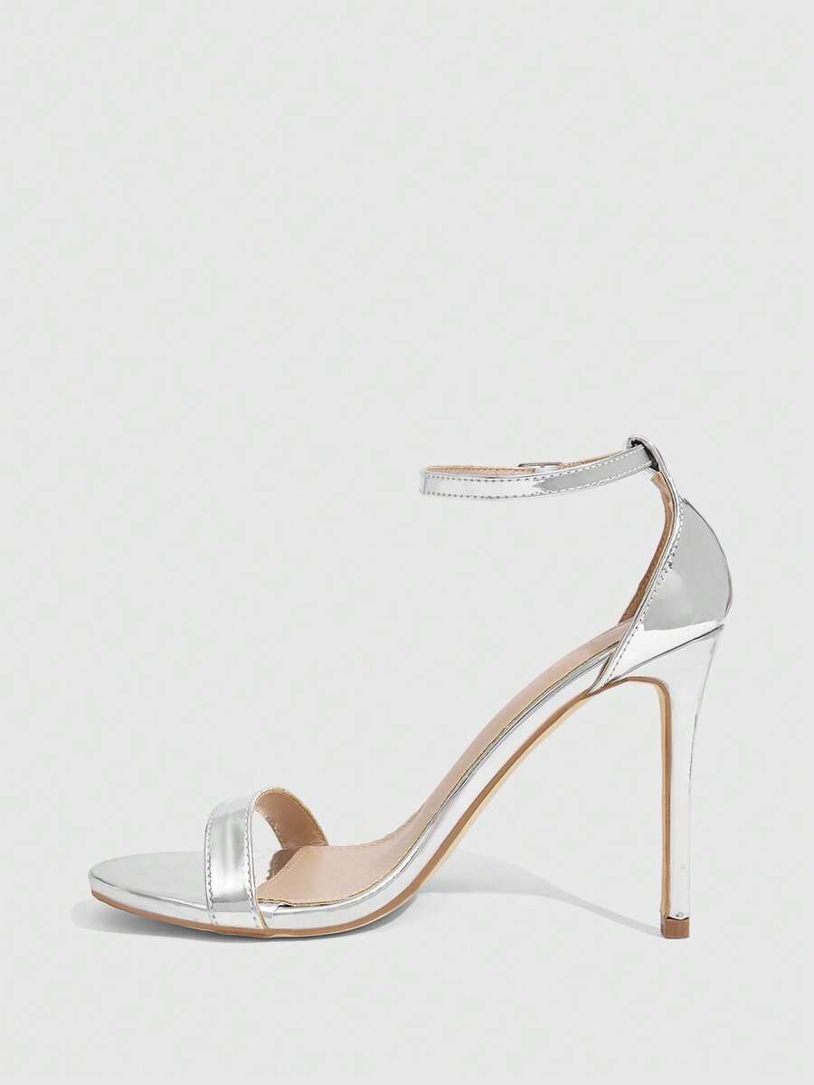 Women's stiletto sandals featuring an ankle strap buckle closure and classic round open toe design.