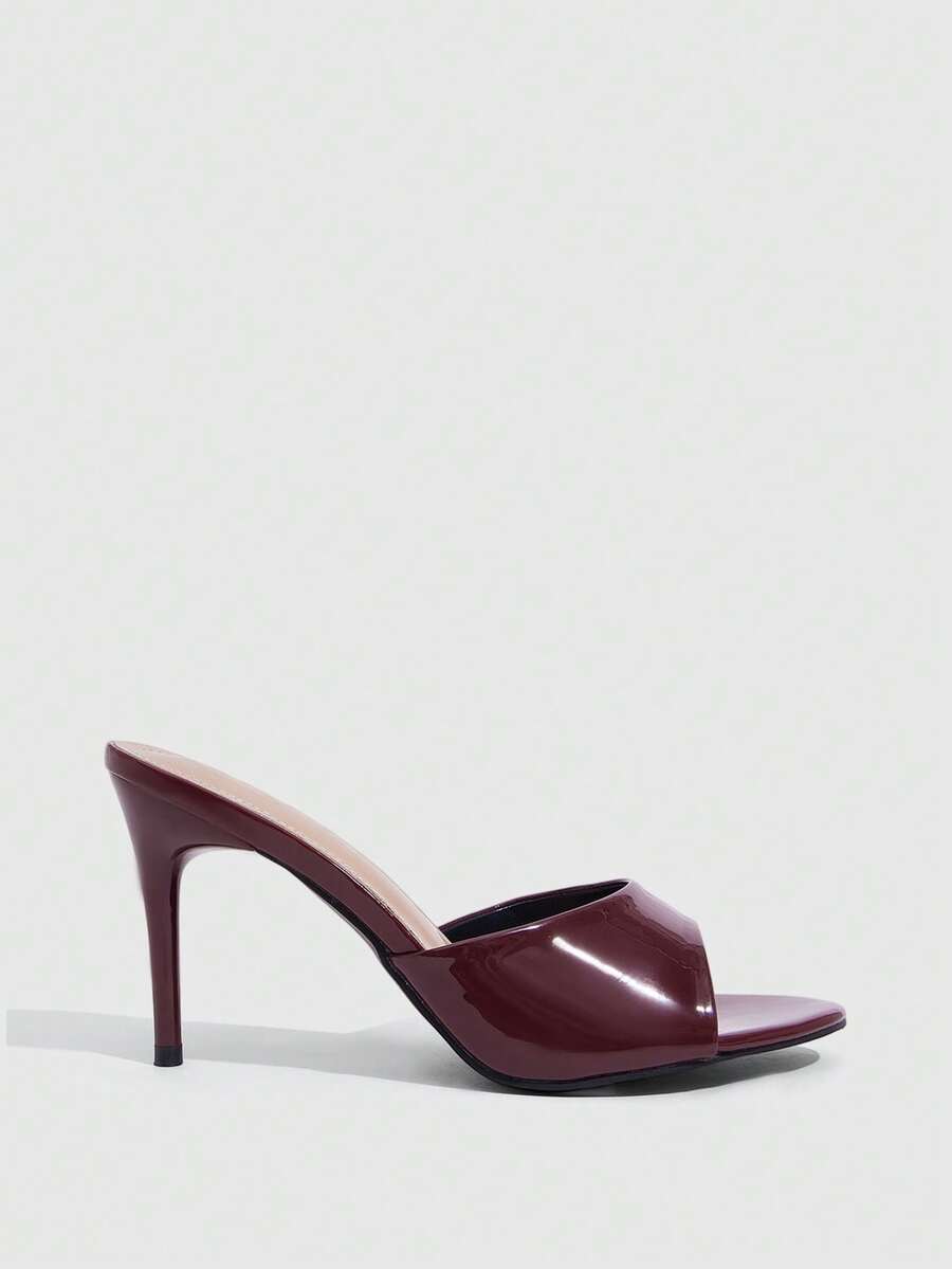 Women's open toe high heel sandals with slingback strap and sleek stiletto heel in smooth PU leather.