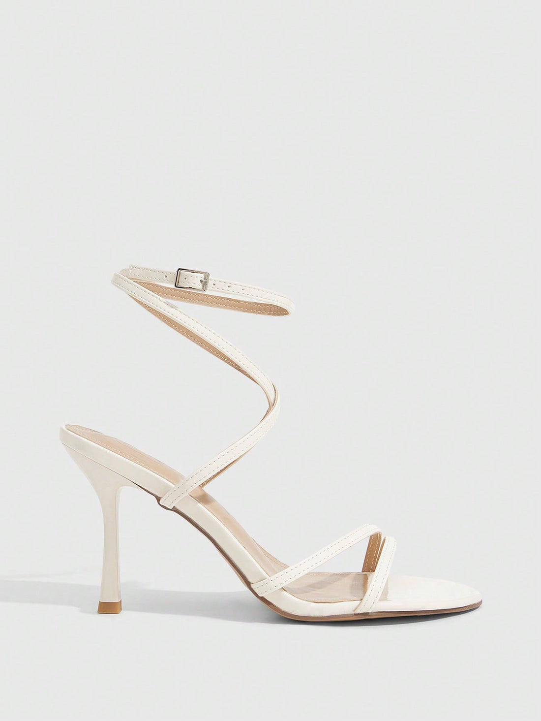 Women's square toe stiletto high heeled sandals with ankle strap buckle in a sleek faux leather finish.