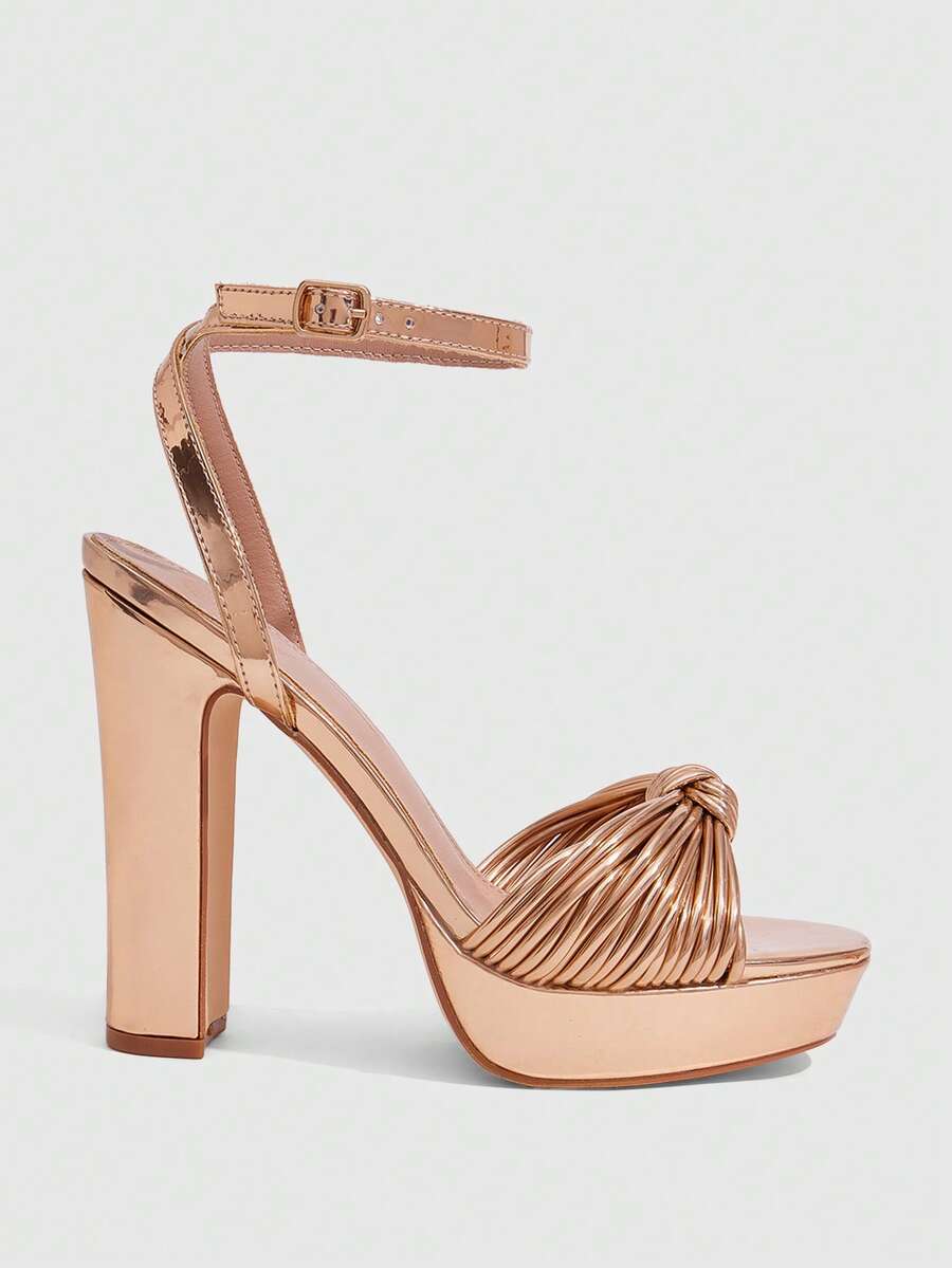 Women's platform block heel sandals featuring an open toe design and an adjustable ankle strap buckle closure.