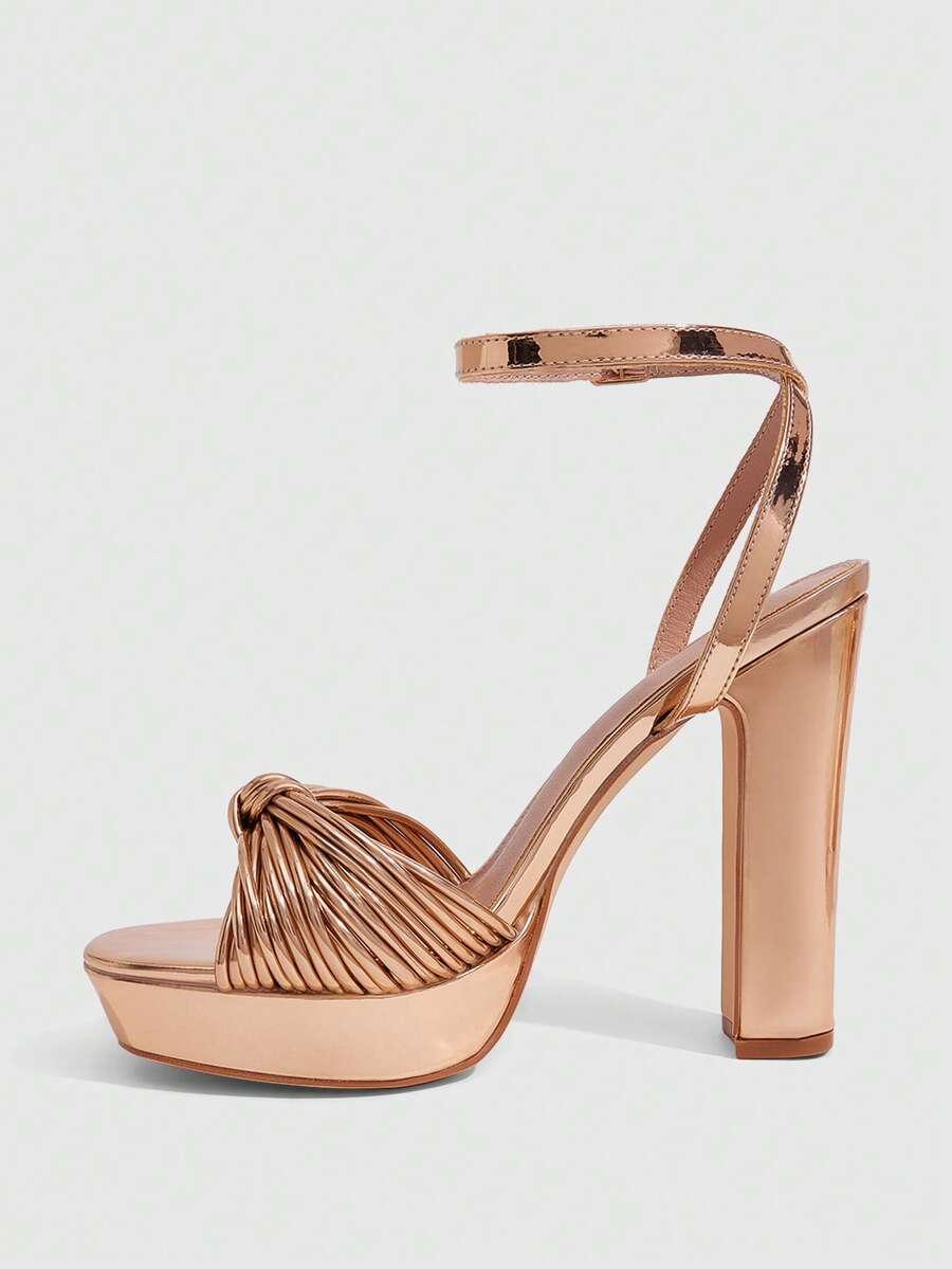 Women's platform block heel sandals featuring an open toe design and an adjustable ankle strap buckle closure.
