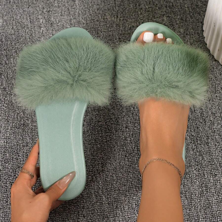 Women's open toe faux fur slide sandals featuring a wide fluffy strap, flat sole, and backless slip-on design.