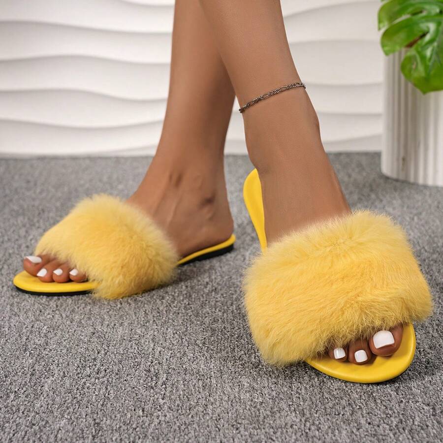 Women's open toe faux fur slide sandals featuring a wide fluffy strap, flat sole, and backless slip-on design.