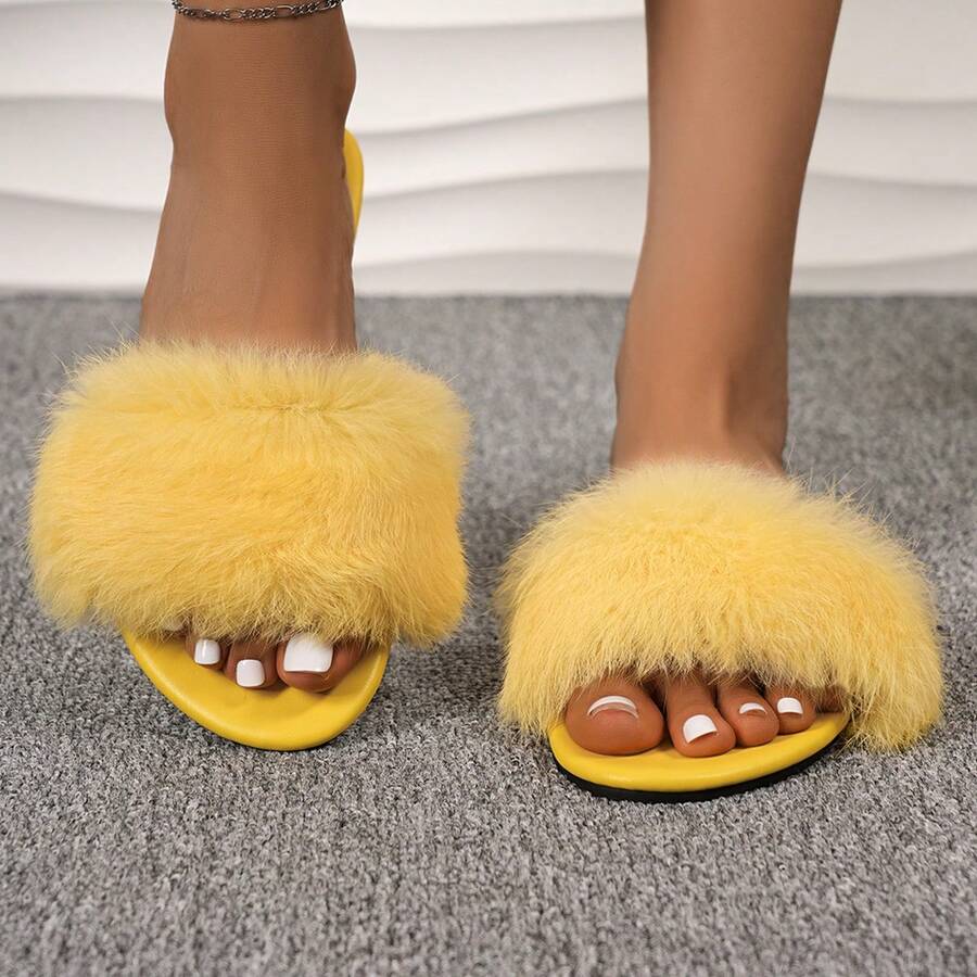 Women's open toe faux fur slide sandals featuring a wide fluffy strap, flat sole, and backless slip-on design.