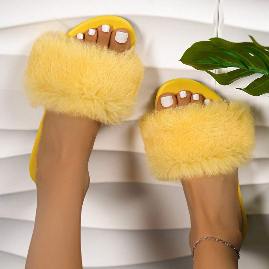 Women's open toe faux fur slide sandals featuring a wide fluffy strap, flat sole, and backless slip-on design.