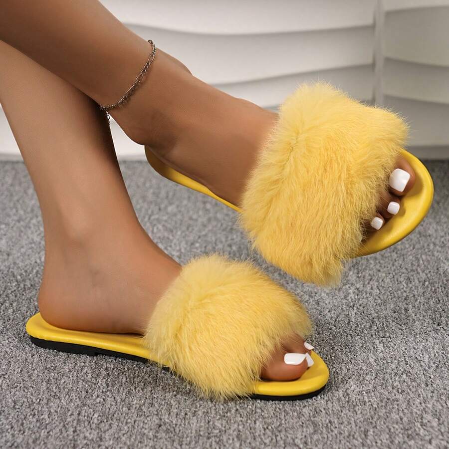 Women's open toe faux fur slide sandals featuring a wide fluffy strap, flat sole, and backless slip-on design.