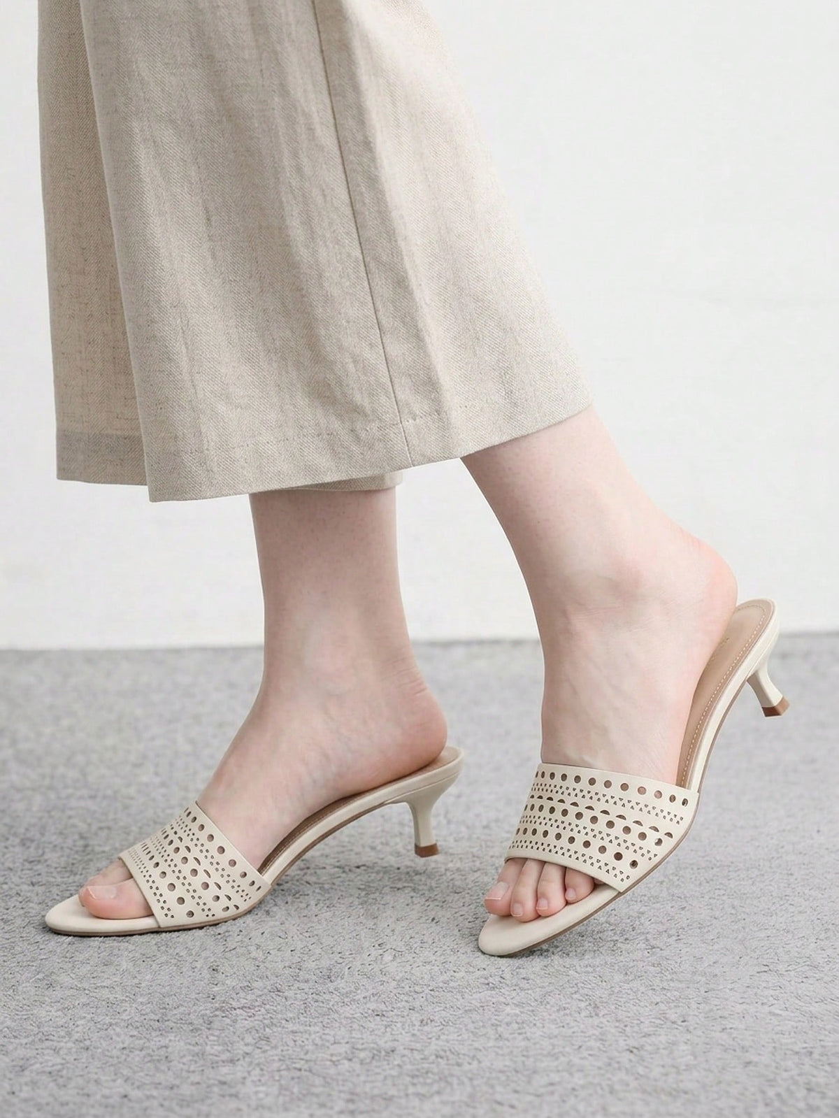 Pair of women's open toe high heel slingback sandals made with smooth PU leather