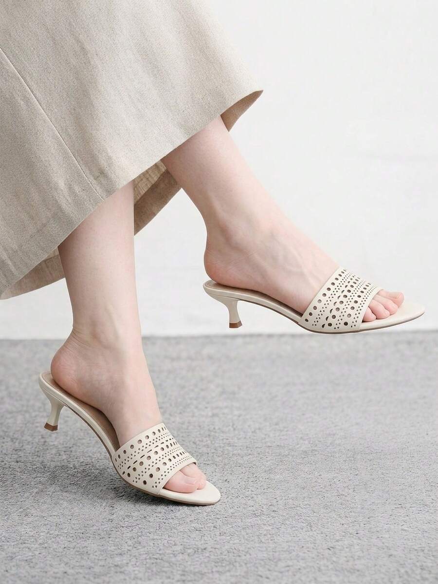 Pair of women's open toe high heel slingback sandals made with smooth PU leather