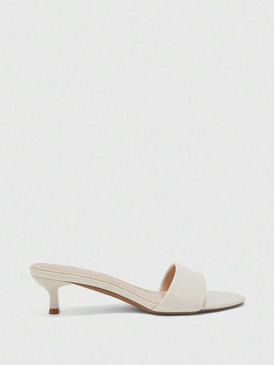Women's slip on kitten heel mules and open toe heeled sandals in apricot