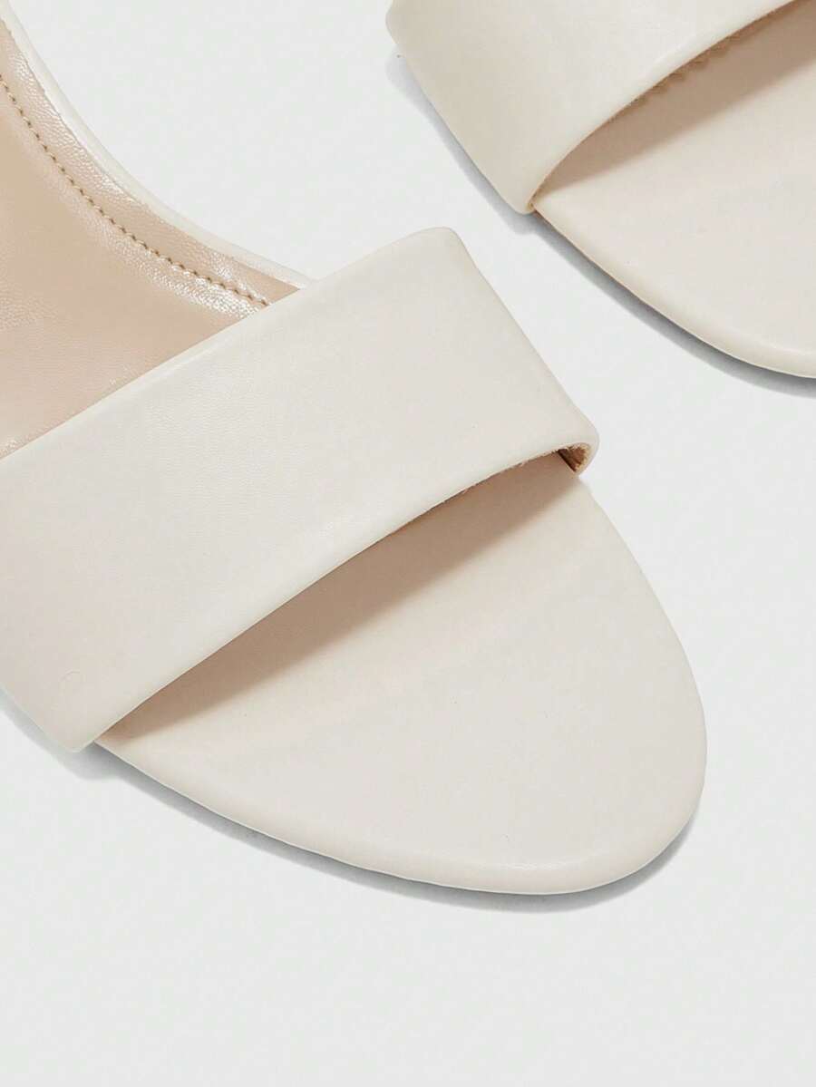 Women's slip on kitten heel mules and open toe heeled sandals in apricot