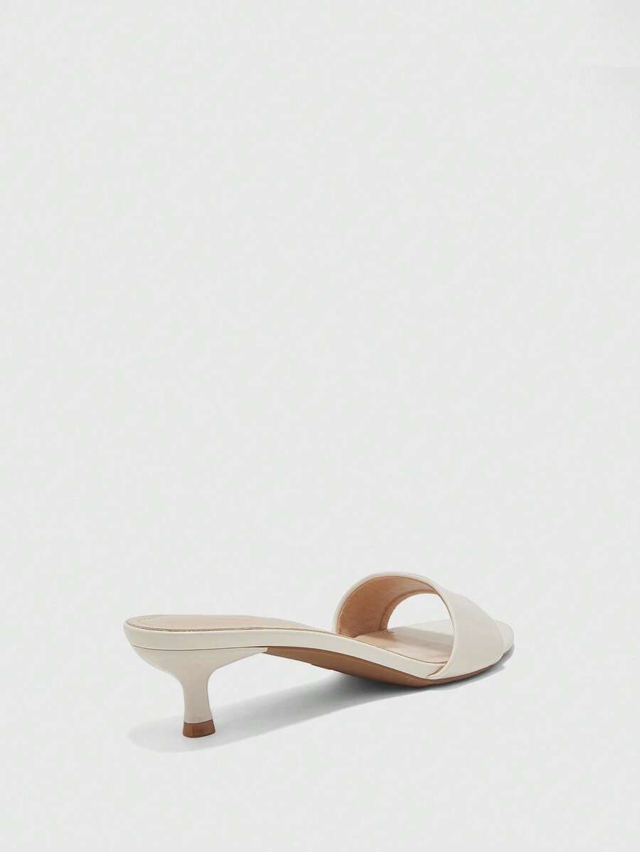 Women's slip on kitten heel mules and open toe heeled sandals in apricot