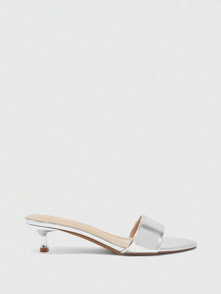 Women's slip on kitten heel mules and open toe heeled sandals in apricot