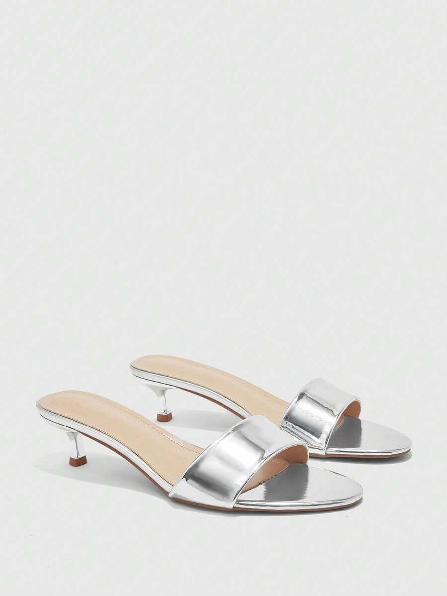 Women's slip on kitten heel mules and open toe heeled sandals in apricot