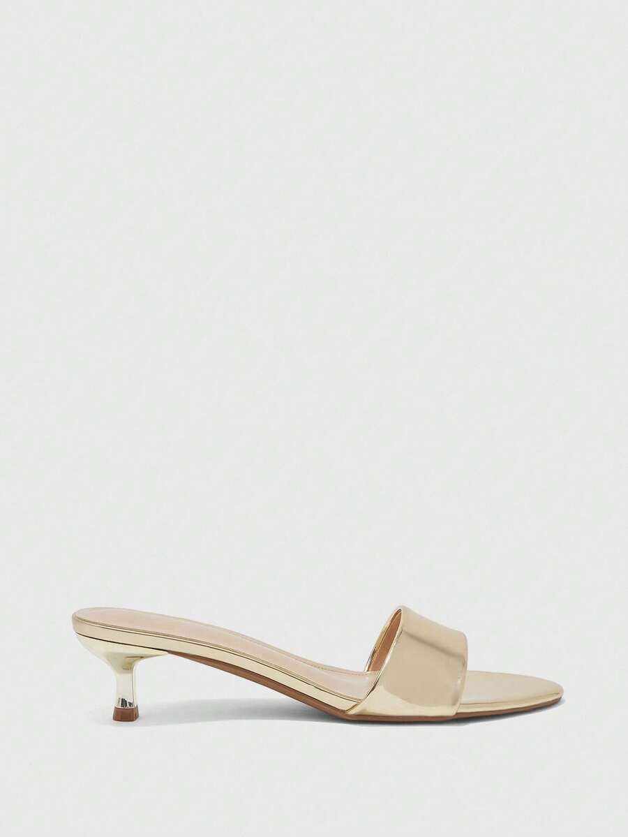 Pair of women's open toe high heel slingback sandals made with smooth PU leather