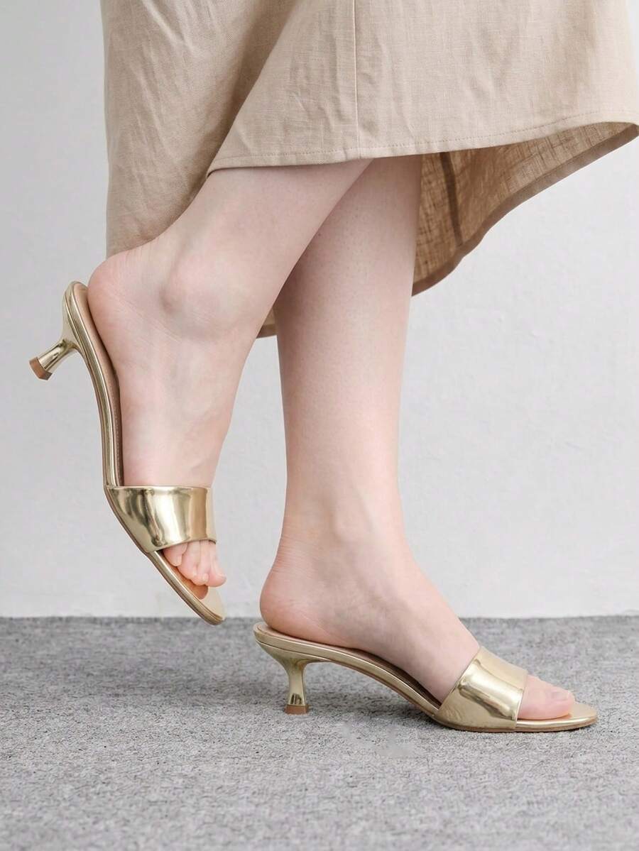 Pair of women's open toe high heel slingback sandals made with smooth PU leather