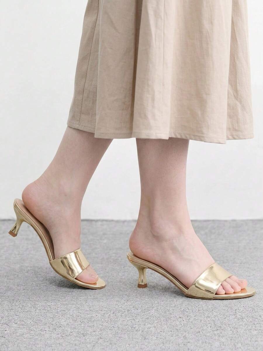 Pair of women's open toe high heel slingback sandals made with smooth PU leather