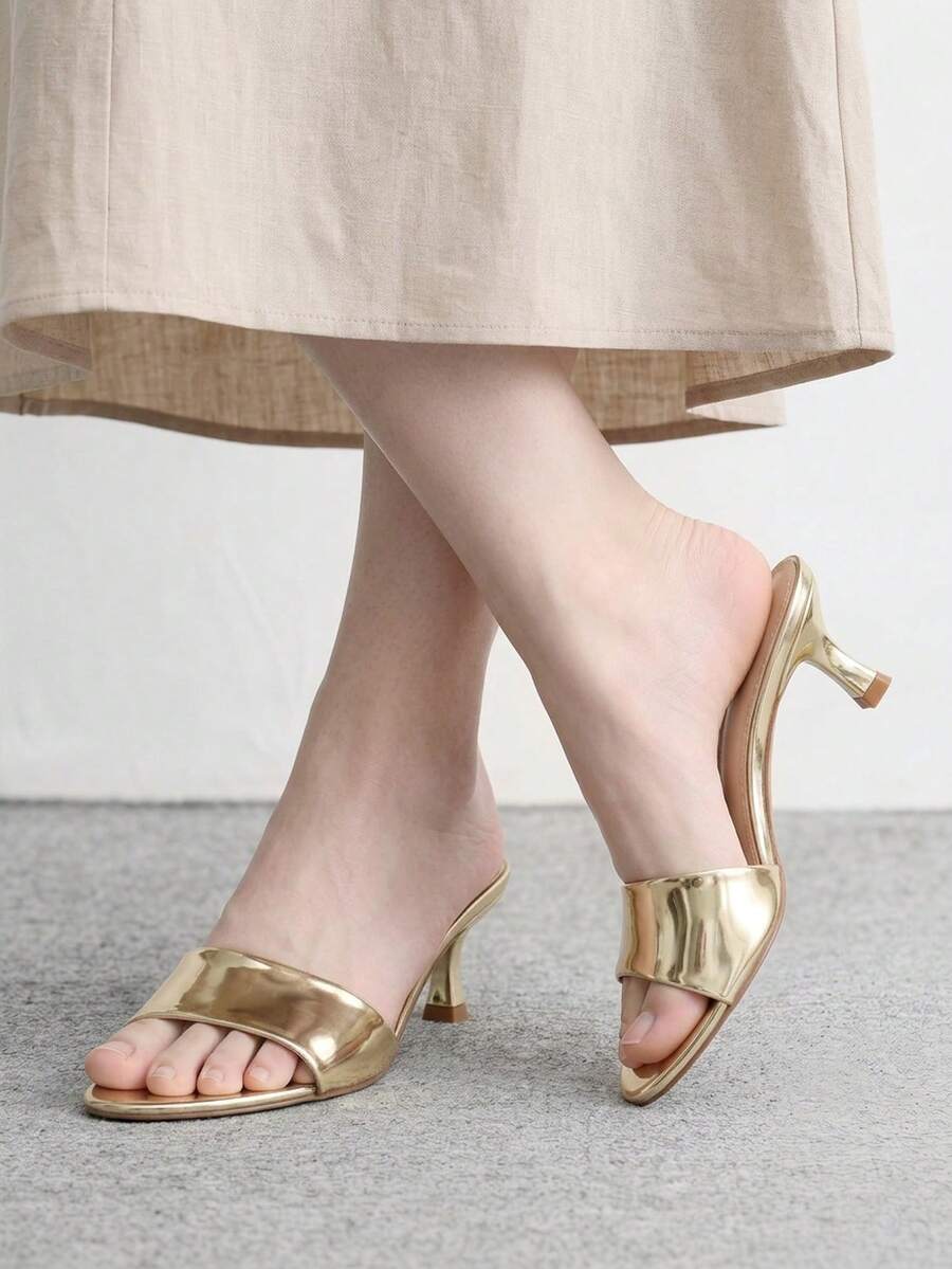 Pair of women's open toe high heel slingback sandals made with smooth PU leather