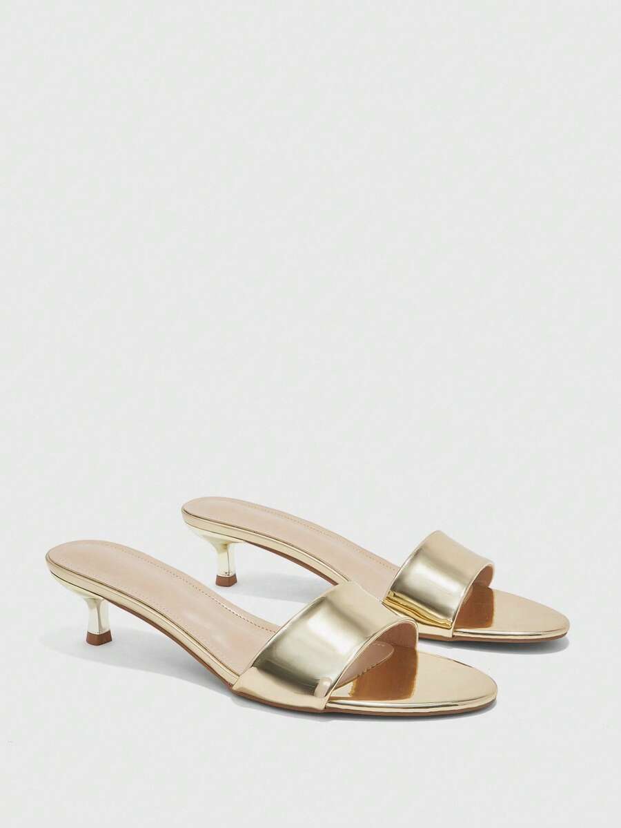 Pair of women's open toe high heel slingback sandals made with smooth PU leather