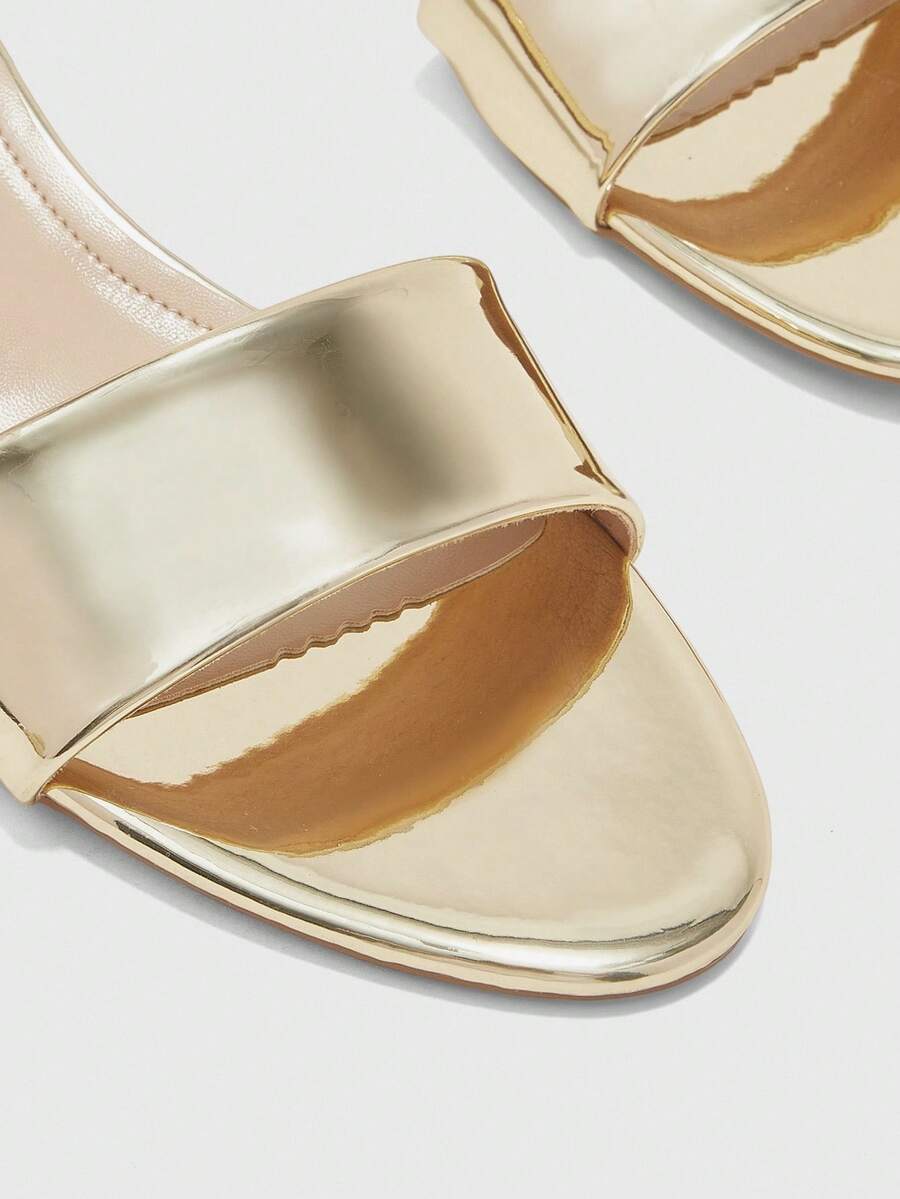 Pair of women's open toe high heel slingback sandals made with smooth PU leather