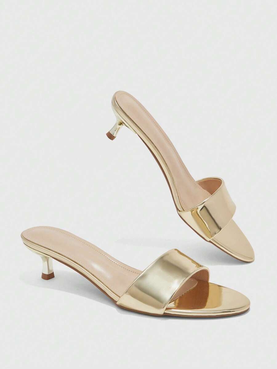 Pair of women's open toe high heel slingback sandals made with smooth PU leather