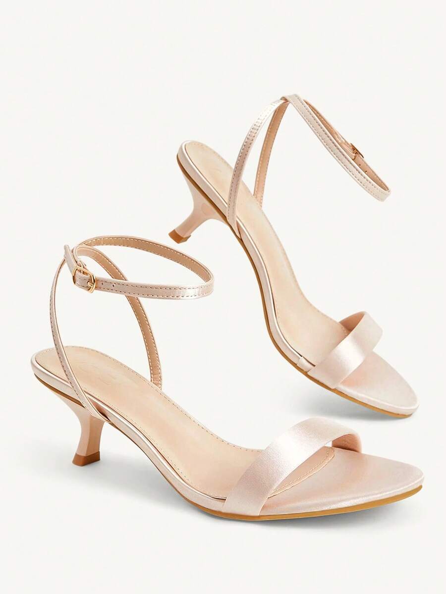 Women's open-toed high-heeled sandals featuring a 5.5cm kitten heel stiletto, sleek ankle strap with buckle closure, and smooth PU leather finish.