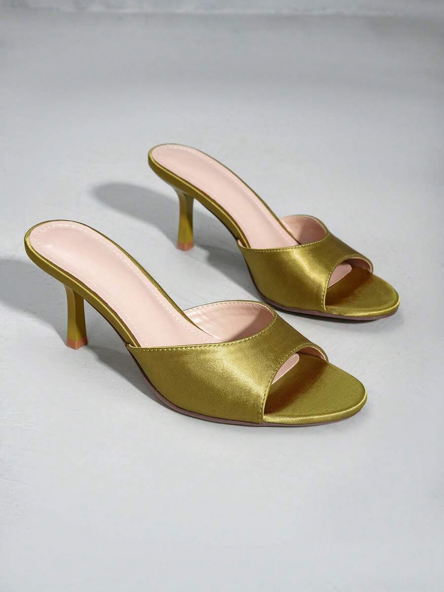 Elegant women's black stiletto heel sandals with open toe slingback design and PU leather upper.