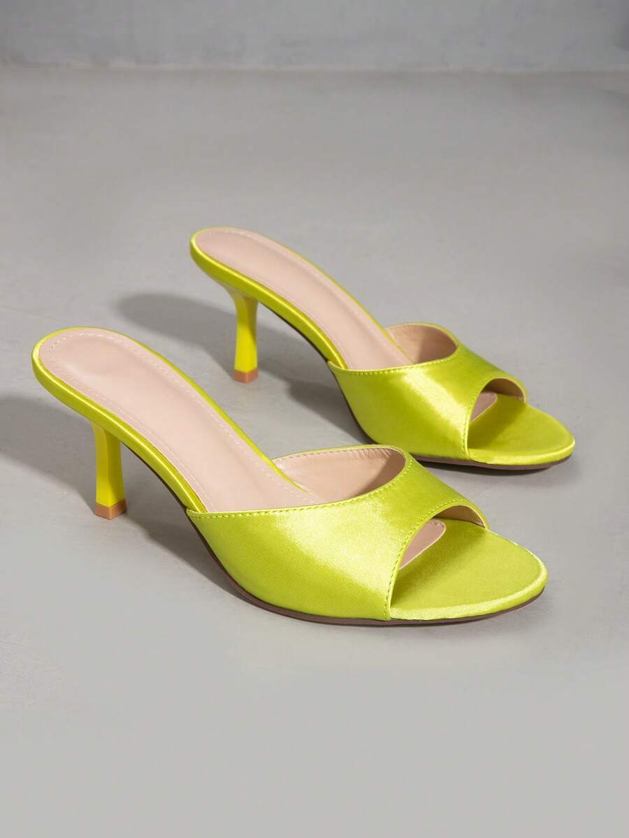 Elegant women's black stiletto heel sandals with open toe slingback design and PU leather upper.