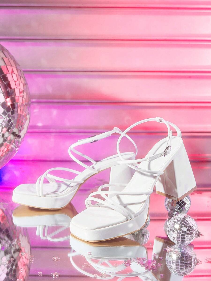 Women's high-heeled sandals with textured pattern, open toe design, chunky heel, and adjustable ankle buckle strap.