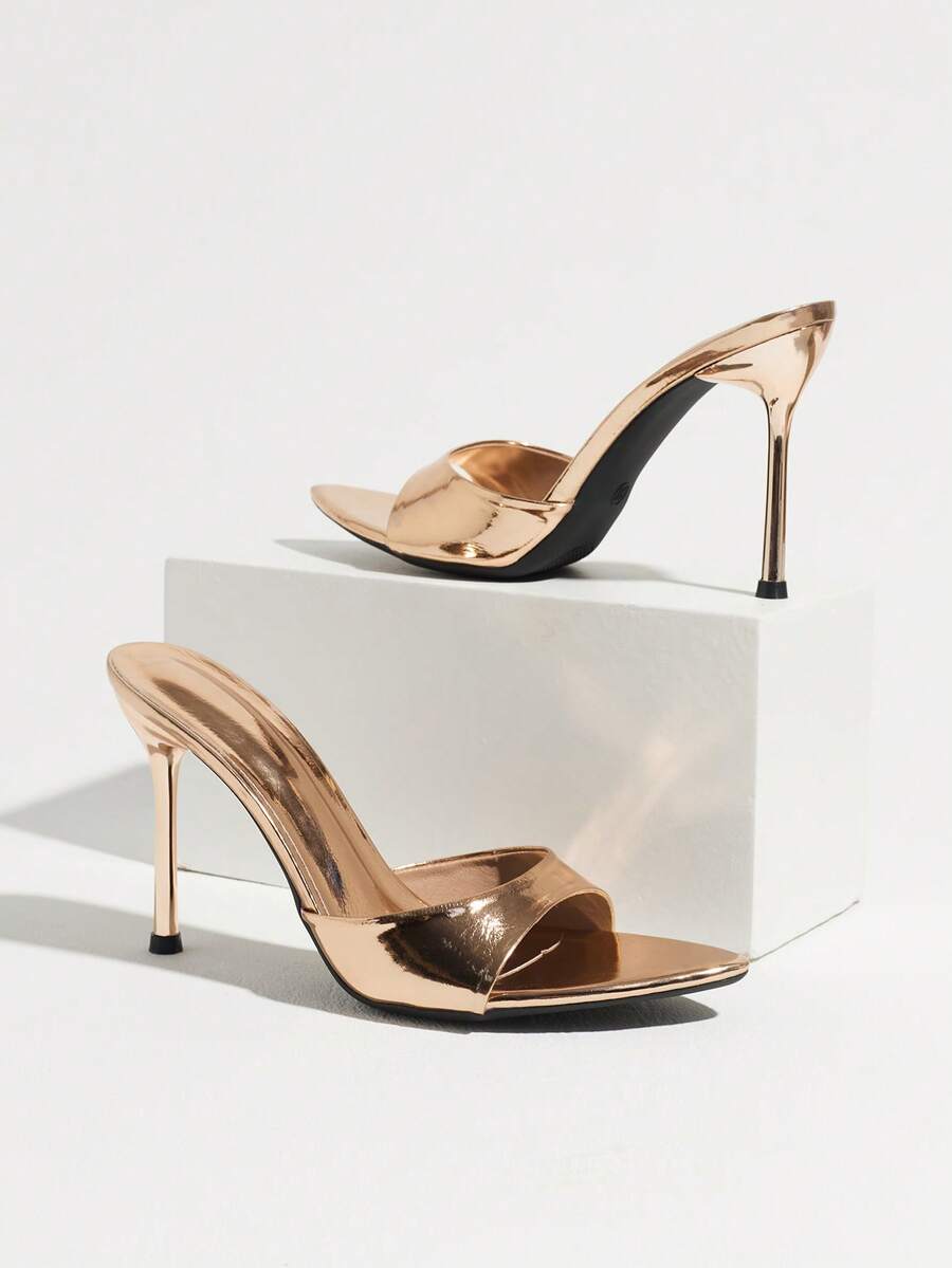 Women's elegant open toe high heel party mules featuring sleek stiletto heels and a slip-on design.