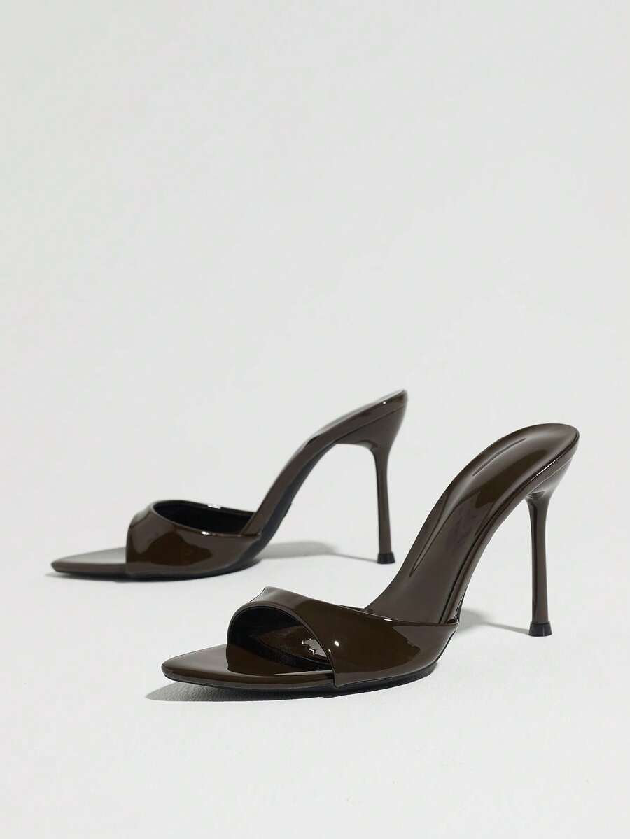 Women's elegant open toe high heel party mules featuring sleek stiletto heels and a slip-on design.
