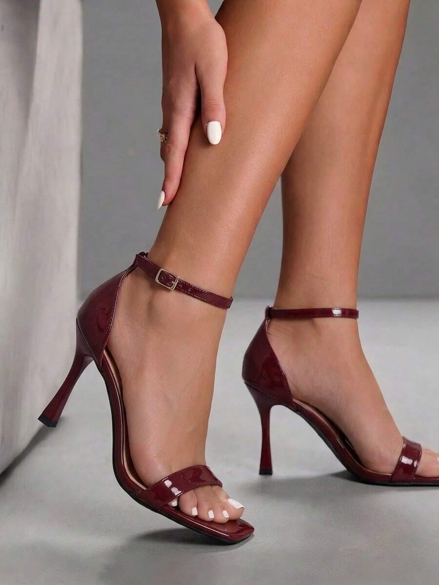 Women's open square toe stiletto high heel sandals featuring thin ankle straps and buckle closure.