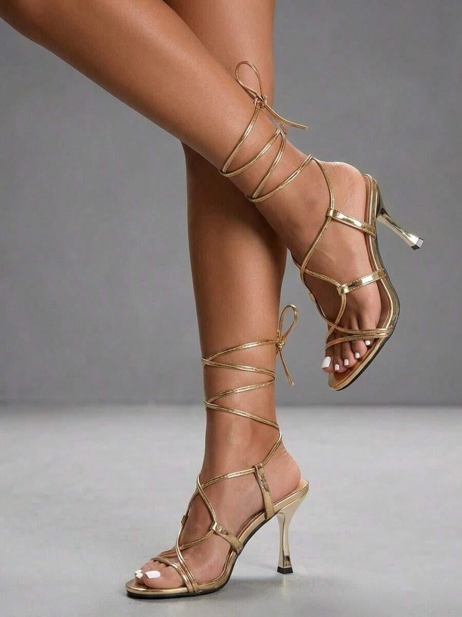 Women's open toe stiletto high heel sandals with criss cross straps and sleek PU leather finish