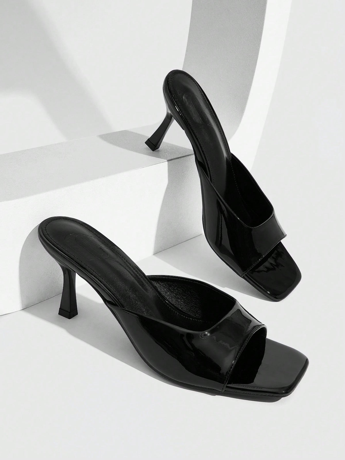 Women's elegant square toe stiletto high heel sandals featuring an open toe and sleek slingback strap