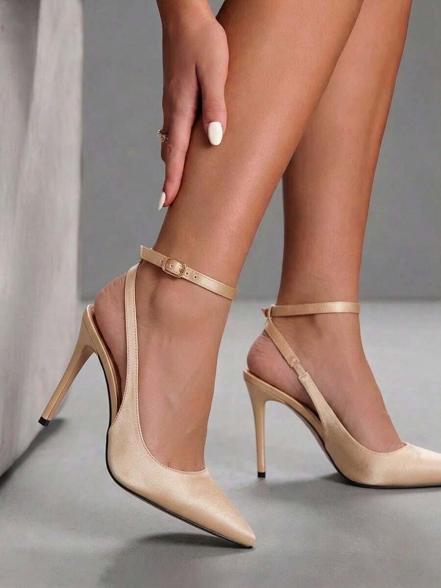 Pointed toe stiletto high heels with slingback silhouette and adjustable buckle ankle strap.