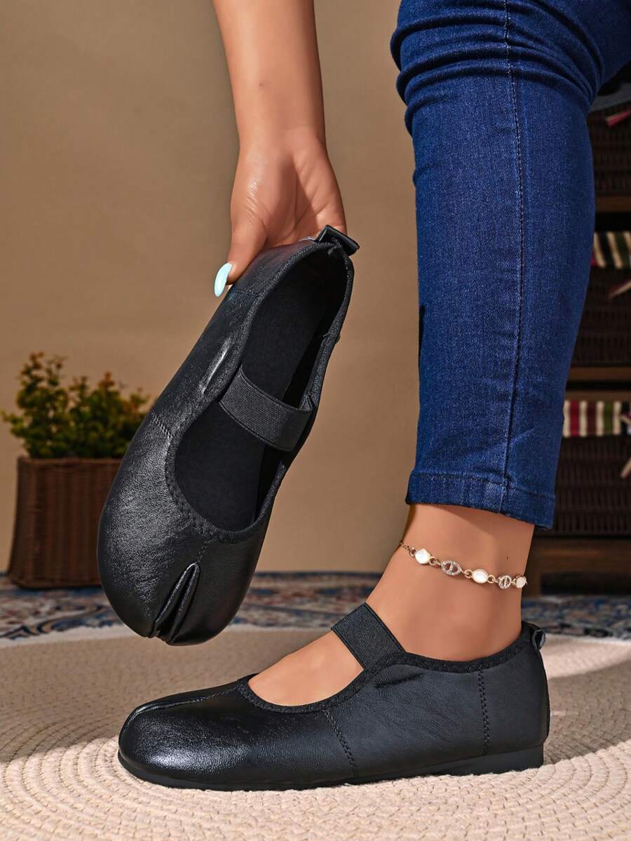 Women's white split-toe slip-on flat shoes with braided accent and rubber sole