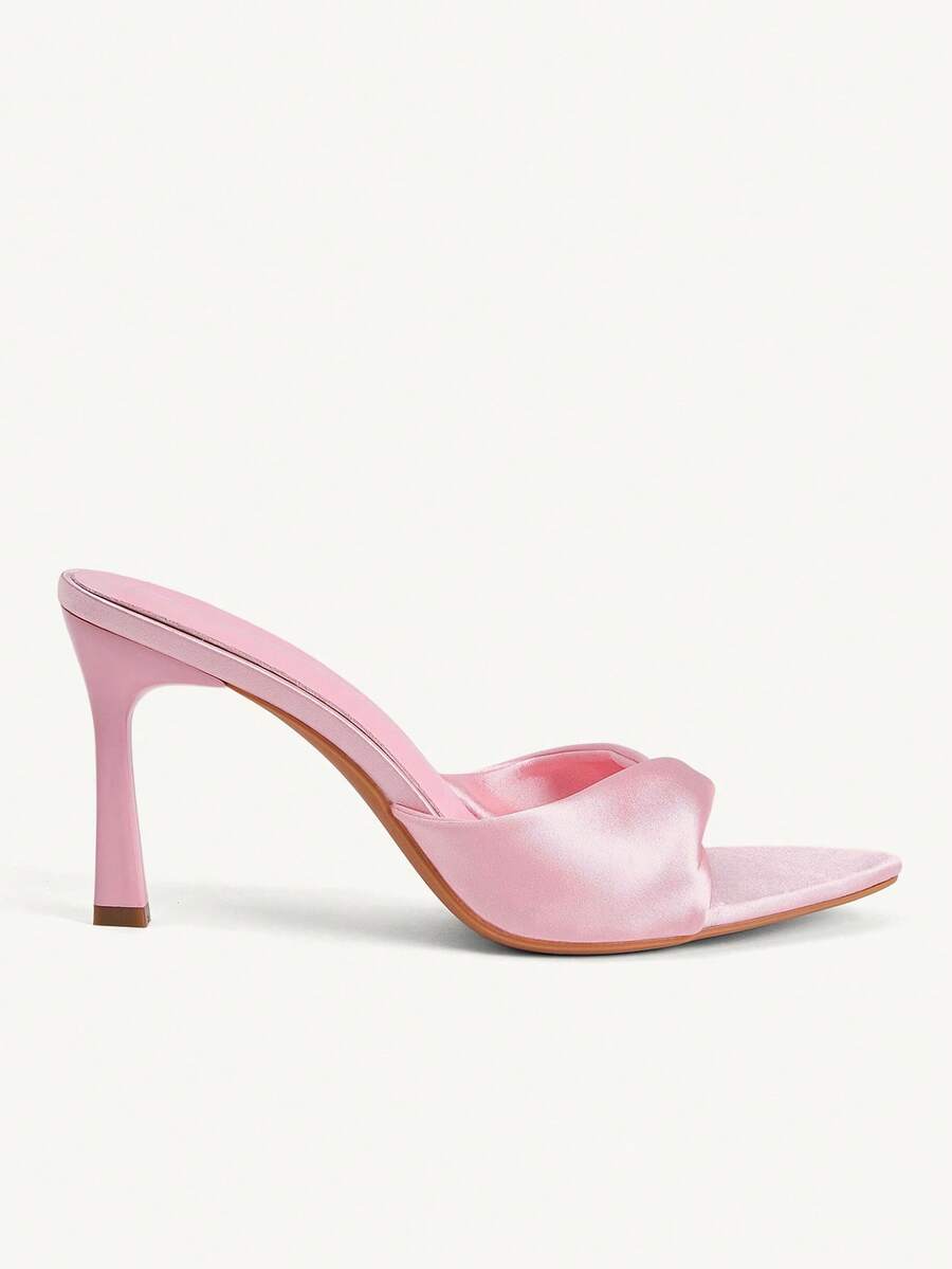 Women's peep toe high-heeled stiletto sandals with slingback strap in light metallic finish.
