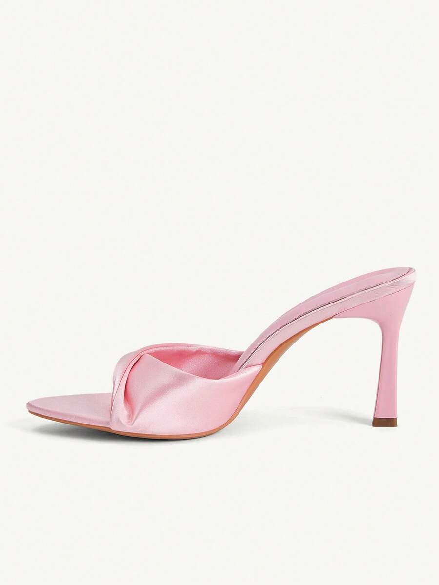 Women's peep toe high-heeled stiletto sandals with slingback strap in light metallic finish.